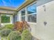 Exterior of home with a covered porch, outdoor shower and manicured landscaping creating an inviting outdoor space at 12313 Prairie Plantation Way, Orlando, FL 32824