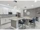 Open concept kitchen with pendant lighting, stainless appliances, and barstool seating at 12313 Prairie Plantation Way, Orlando, FL 32824
