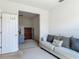 Comfortable living area leading to a serene bedroom with a classic dresser at 12313 Prairie Plantation Way, Orlando, FL 32824
