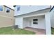 Home featuring a cozy covered patio and a small backyard at 12537 Encore At Ovation Way, Winter Garden, FL 34787