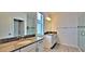 Modern bathroom with double sink vanity, granite countertops, and glass-enclosed shower at 12537 Encore At Ovation Way, Winter Garden, FL 34787