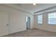 Comfortable bedroom with neutral carpet, two windows, and plenty of natural light at 12537 Encore At Ovation Way, Winter Garden, FL 34787