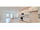 Bright, spacious kitchen featuring white cabinets, island with granite countertops, and stainless steel appliances at 12537 Encore At Ovation Way, Winter Garden, FL 34787