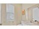 Neutral bathroom with white cabinets and granite counters at 1428 Reunion Blvd, Kissimmee, FL 34747