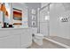 Modern bathroom featuring a glass-enclosed shower, sleek fixtures, and stylish decor at 1428 Reunion Blvd, Kissimmee, FL 34747