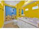Bright bathroom with a double vanity, modern fixtures, and a Minion themed shower curtain at 1428 Reunion Blvd, Kissimmee, FL 34747