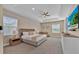 Spacious bedroom features a neutral color palette, carpeted floors, tray ceilings, and ample natural light at 1428 Reunion Blvd, Kissimmee, FL 34747