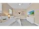 Bright bedroom featuring two beds, soft neutral colors and light gray carpet at 1428 Reunion Blvd, Kissimmee, FL 34747