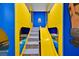 Fun bedroom with custom bunk beds, a slide, and playful minion themed decor at 1428 Reunion Blvd, Kissimmee, FL 34747