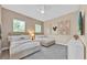 Cozy bedroom with two beds, soft lighting, and playful decorative wall art at 1428 Reunion Blvd, Kissimmee, FL 34747
