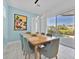 Light blue dining room with view of pool area at 1428 Reunion Blvd, Kissimmee, FL 34747