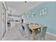 Modern dining area with view of the kitchen and unique lighting fixture at 1428 Reunion Blvd, Kissimmee, FL 34747