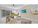 Cozy living room featuring a comfortable sofa, stylish decor, and natural light from the window at 1428 Reunion Blvd, Kissimmee, FL 34747
