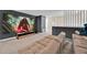 Entertainment area with a large projector screen, comfortable seating, and modern decor at 1428 Reunion Blvd, Kissimmee, FL 34747