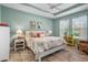 Inviting primary bedroom with tray ceiling, natural light, and stylish decor at 1631 Nina Dr, Davenport, FL 33837
