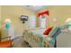 Bright bedroom features nautical themed decor, tv, and tile floors at 1631 Nina Dr, Davenport, FL 33837
