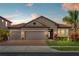 Charming home with a tile roof, brick driveway, and well-manicured landscaping at 1631 Nina Dr, Davenport, FL 33837