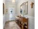 Welcoming foyer with elegant wainscoting and stylish console table at 1631 Nina Dr, Davenport, FL 33837