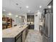 A well-equipped kitchen with a large island, stainless steel appliances, and plenty of cabinet space at 1631 Nina Dr, Davenport, FL 33837