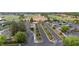The parking lot at the clubhouse has several lanes of parking with trees in the median at 1631 Nina Dr, Davenport, FL 33837