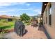 Outdoor patio with grill, table, and view of the landscaped backyard and neighboring homes at 1631 Nina Dr, Davenport, FL 33837