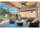 Screened lanai featuring comfortable seating, a ceiling fan, and an outdoor living space perfect for relaxation at 1631 Nina Dr, Davenport, FL 33837