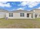 View of the backyard, showcasing the property's outdoor space and patio at 1828 Buckeye Rd, Davenport, FL 33837
