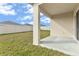 Covered patio and view of backyard, providing a comfortable outdoor space at 1828 Buckeye Rd, Davenport, FL 33837