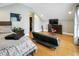Spacious bedroom with hardwood floors, comfortable furniture, and a walk-in closet at 202 Acadia Ter, Kissimmee, FL 34747