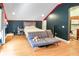 Cozy bedroom features a futon, red LED accent lighting and an attached kitchen at 202 Acadia Ter, Kissimmee, FL 34747