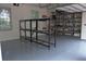 Clean garage with shelving and epoxy flooring at 202 Acadia Ter, Kissimmee, FL 34747