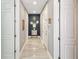 Hallway featuring fresh gray paint, white trim, and modern lighting at 202 Acadia Ter, Kissimmee, FL 34747