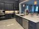 Well appointed kitchen with stainless steel appliances, dark cabinetry and wine storage at 202 Acadia Ter, Kissimmee, FL 34747