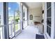 Bright sun room featuring neutral decor, dining set, and a view of the outdoors at 202 Acadia Ter, Kissimmee, FL 34747