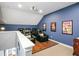 Home theater room with tiered seating, movie themed decor, projector and wood flooring stage at 202 Acadia Ter, Kissimmee, FL 34747