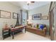 Comfortable bedroom featuring a couch and various decor elements at 206 Norfolk Pl, Celebration, FL 34747