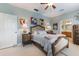 Comfortable bedroom featuring a charming bed, stylish decor, and tranquil view of a luxurious space at 206 Norfolk Pl, Celebration, FL 34747