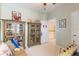 Comfortable bedroom featuring decorative shelving, couch, and various decorative elements at 206 Norfolk Pl, Celebration, FL 34747