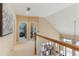 Open second floor hallway with great view to the living room below with natural light from large windows at 206 Norfolk Pl, Celebration, FL 34747