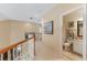 Second floor hallway with railing, recessed lighting, and access to a full bathroom at 206 Norfolk Pl, Celebration, FL 34747