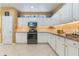 Well-equipped kitchen with white cabinets, granite countertops, tile backsplash, and modern appliances at 206 Norfolk Pl, Celebration, FL 34747