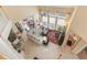 Bright, open living room with high ceilings, large windows, and tile floors showcasing a comfortable and stylish space at 206 Norfolk Pl, Celebration, FL 34747