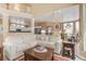 Bright, open-concept living room featuring a soaring ceiling, neutral decor, and a view into the kitchen at 206 Norfolk Pl, Celebration, FL 34747