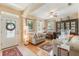 Cozy living room featuring hardwood floors, neutral walls, and comfortable seating at 206 Norfolk Pl, Celebration, FL 34747