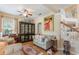 Inviting living room with hardwood floors, classic display cabinet, and comfortable seating at 206 Norfolk Pl, Celebration, FL 34747