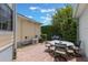 Enclosed brick patio with outdoor furniture and a grill, ideal for outdoor dining at 206 Norfolk Pl, Celebration, FL 34747