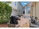Cozy brick patio with a grill and outdoor seating, perfect for entertaining at 206 Norfolk Pl, Celebration, FL 34747