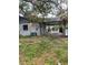 View of home exterior with covered parking and backyard space, ideal for outdoor living at 2071 Liston Ct, Orlando, FL 32811