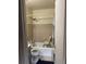 A full bathroom equipped with a shower seat, sink, and toilet at 2071 Liston Ct, Orlando, FL 32811