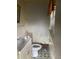 Cozy bathroom with vintage patterned tile flooring, toilet and sink at 2071 Liston Ct, Orlando, FL 32811